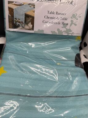 The Meadow Creek 14x72 inch Table Runner in Aqua with Nutcrackers